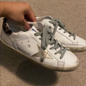 Golden Goose superstar distressed sneakers.